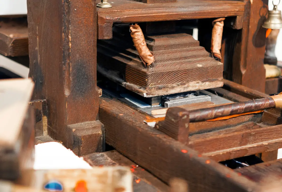 Traditional wooden printing press used for letterpress printing and printmaking.