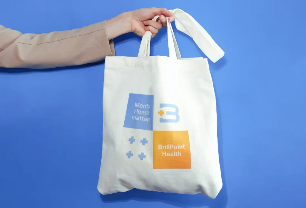 Branded tote bag with a company logo as a practical corporate gift for clients, employees and events.