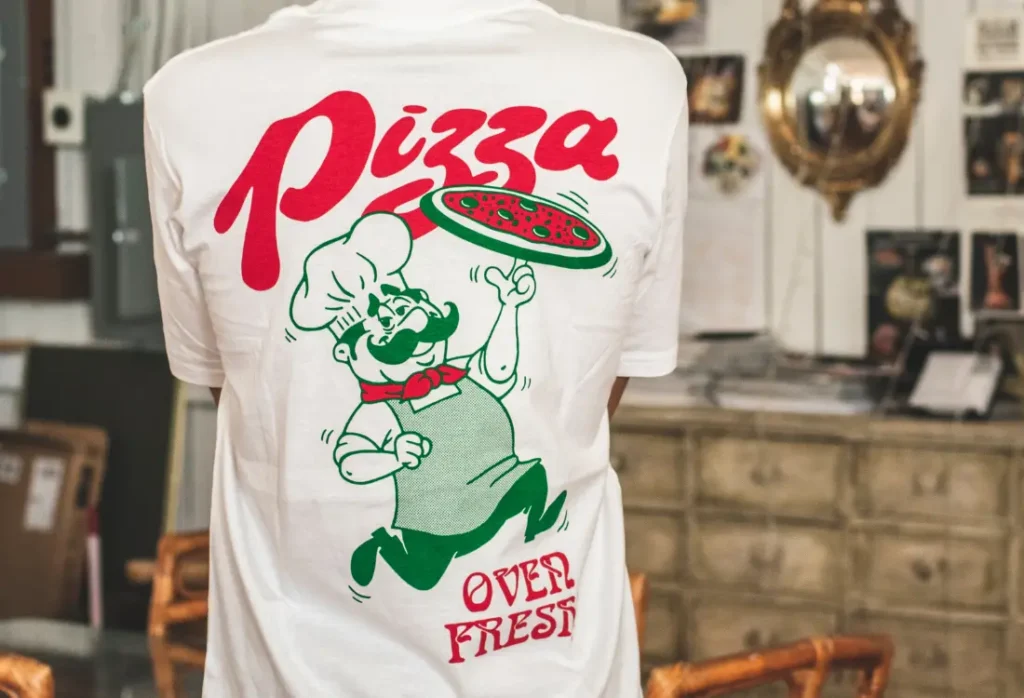 White printed T-shirt with a large full-back design, showing bold T-shirt logo placement for custom merchandise.