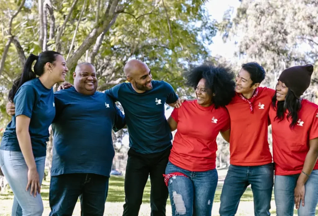Team wearing branded clothing as part of a consistent brand strategy for employees, existing clients and new audiences.