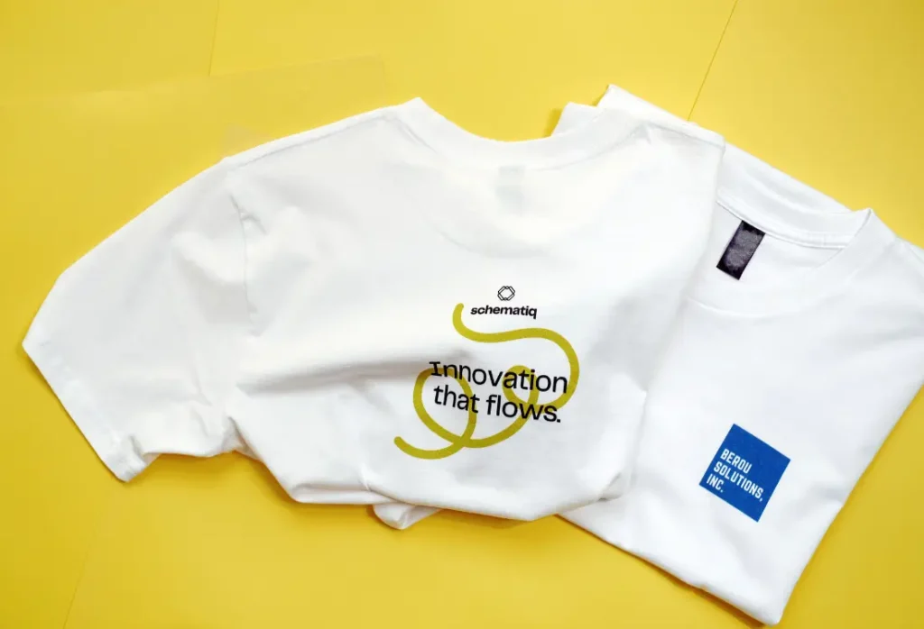Printed branded clothing with different logo placements for companies updating their brand image across multiple products, creating a positive impact for their large corporation.