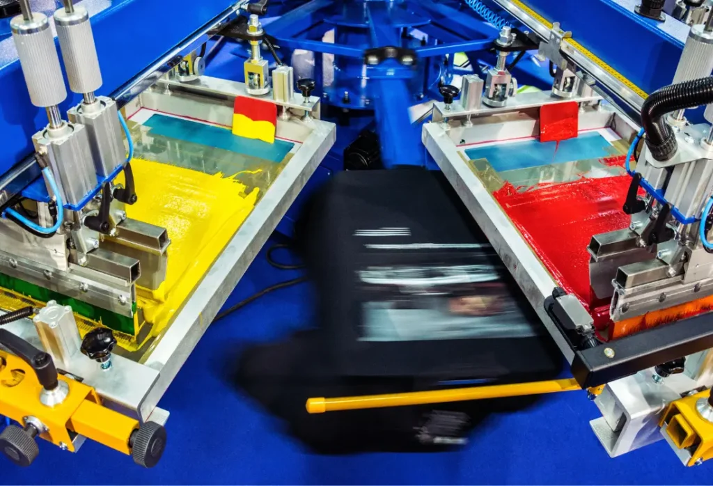 Screen printing process for a bulk printed T-shirt order.