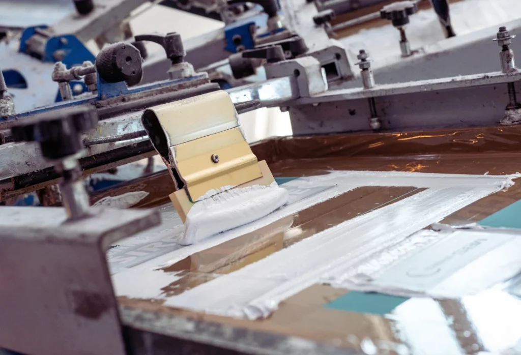 Screen printing process for custom hoodies and sweatshirts at ICON Printing.